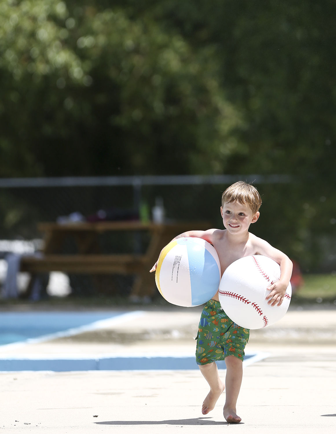 Samuel Hostetler, 4, speedwalks with two blow up balls